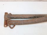an old rusted metal door handle on a white wall