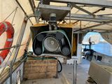 a light that is hanging from the side of a boat