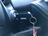 a car key in the center of a car with a keychain attached to it
