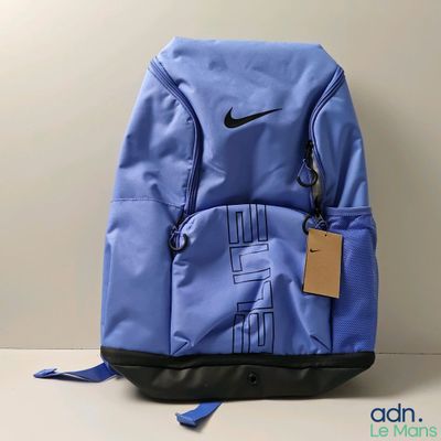 a close up of a blue backpack with a tag on it