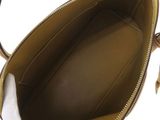 the inside of a handbag with a white glove inside of it