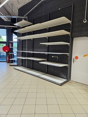a empty store with shelves in the middle of the room