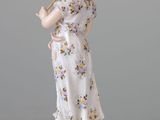 a figurine of a woman holding a baseball bat