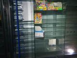 a glass display case in the corner of a store
