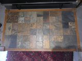 a picture of a tile floor with a tv on top of it