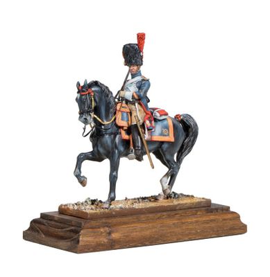 statue of a soldier on a horse on a wooden base