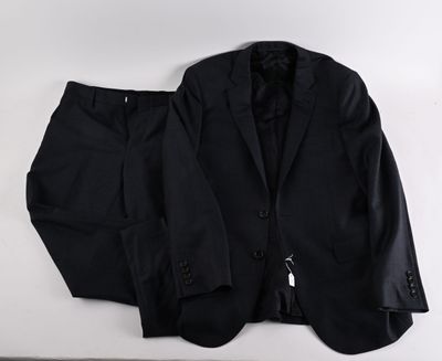 black suit and tie laying on a white surface