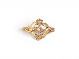 a close up of a gold ring on a white background