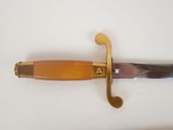 a knife that is laying on a white surface