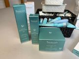 three boxes of skin care products sitting on a table