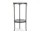 a black metal and glass side table with two shelves
