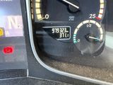 a close up of a car dashboard with a speedometer