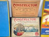 three boxes of construction books sit on a table next to each other