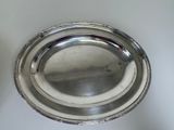 a silver plate that is sitting on a table