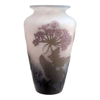 a vase that has a picture of a flower on it