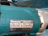 an image of a makita drill with a box in the background