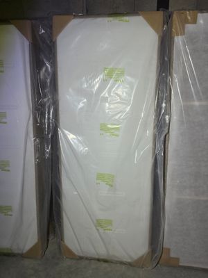 several boxes of mattresses are wrapped in plastic and ready to be shipped