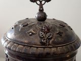 a silver box with a cross on top of it