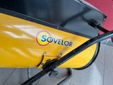 a close up of a yellow machine on a tiled floor