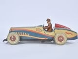 a small toy car with a man in the driver ' s seat