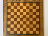 painting of a chess board with figures on it on a wall