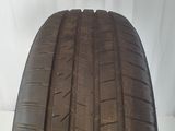 a close up of a tire on a white surface