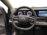 the interior of a car with a steering wheel and dashboard controls