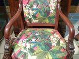 an image of a chair with a colorful floral upholstered seat