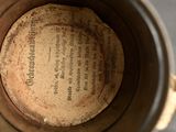 a close up view of a coffee pot with a label on it