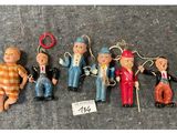 many different pictures of a doll made out of wood