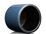 a close up of a blue cup on a white surface