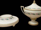 a white bowl and saucer sitting next to each other on a black background