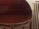 a small table with a mirror on it in a room