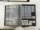 a book with stamps on it sitting on a table