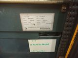 a label on the back of a machine that is sitting on the floor