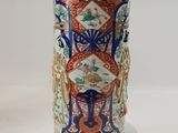 a vase with a design on it sitting on a table