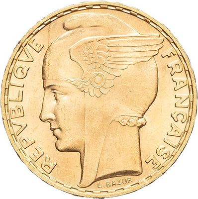 Gros plan sur une pièce d'or ornée d'une tête de femme