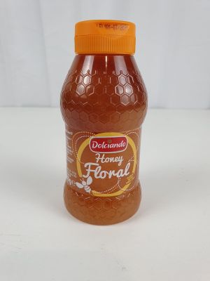un pot de miel posé sur une table