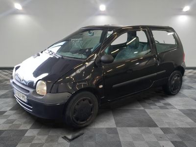 a small black car parked on a checkered floor