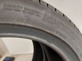 a tire that is on the side of a wall