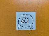 a sticker with a drawing of a number on it