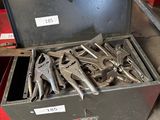 a metal tool box filled with wrenches and pliers