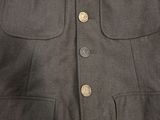 a close up of a jacket with buttons on it