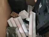 a cardboard box filled with electronic equipment and other items