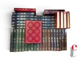 many books stacked on top of each other on a shelf