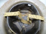 a metal bowl with a yellow rope in it