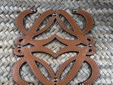 an image of a woven purse with leather handles