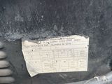 a close up of a black bucket with a sticker on it