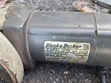 a close up of a motor on the ground