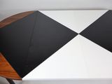 a black and white umbrella sitting on top of a table